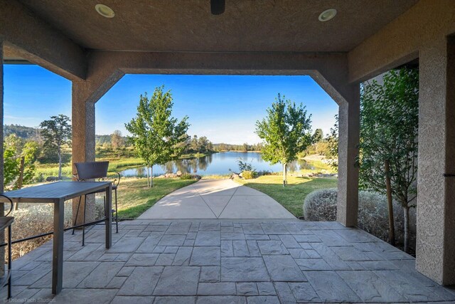 view of patio / terrace featuring a water view