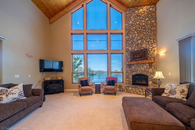 carpeted living room with high vaulted ceiling, a fireplace, and wooden ceiling