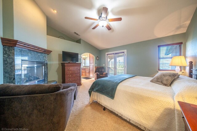 carpeted bedroom featuring ceiling fan and lofted ceiling