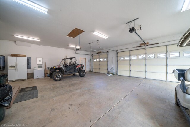 garage featuring a garage door opener, white refrigerator with ice dispenser, and electric panel