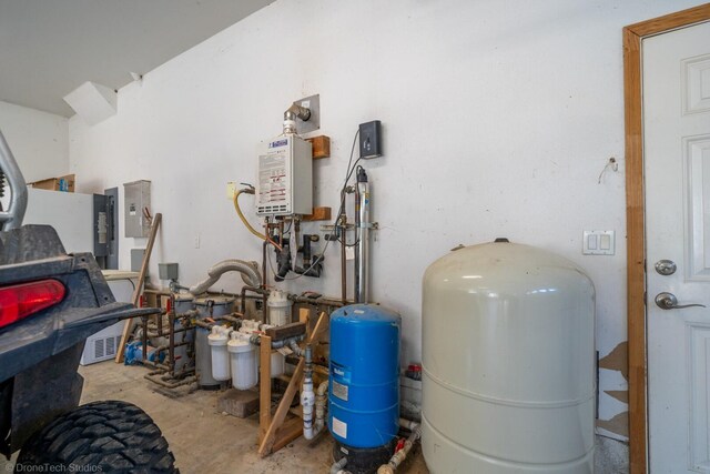 utility room featuring water heater