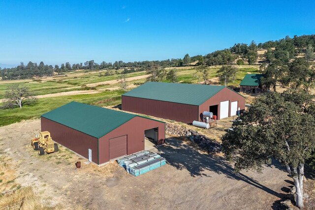 birds eye view of property featuring a rural view