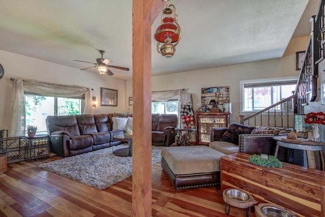 living room featuring ceiling fan and hardwood / wood-style floors