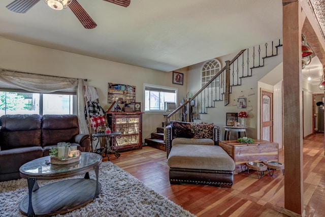 living room featuring hardwood / wood-style flooring and ceiling fan