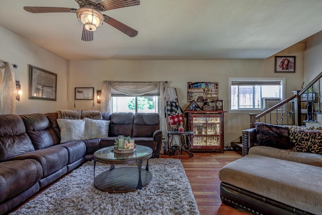 living room with a healthy amount of sunlight, hardwood / wood-style flooring, and ceiling fan