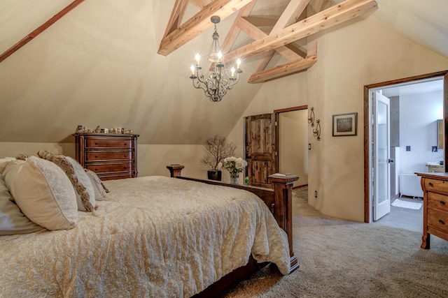 carpeted bedroom with ensuite bathroom and lofted ceiling with beams