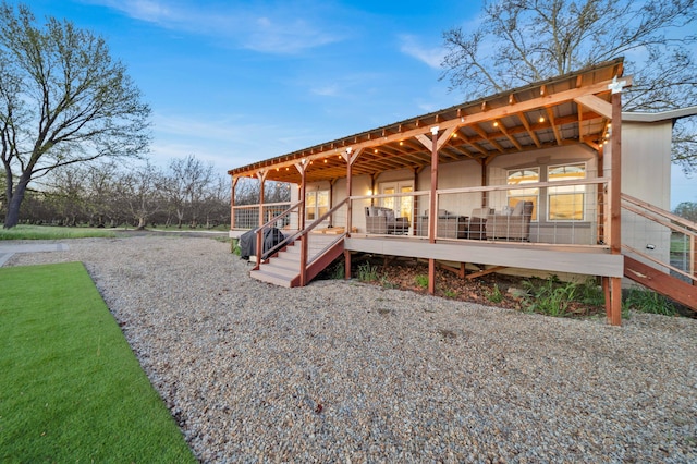 back of house with a lawn