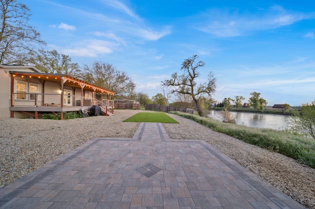 view of patio with a water view