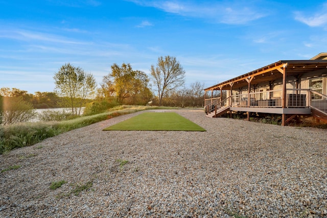 view of yard featuring a wooden deck