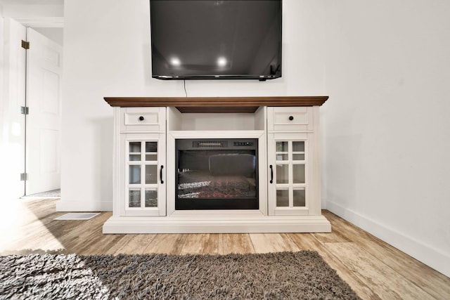 interior details featuring wood-type flooring