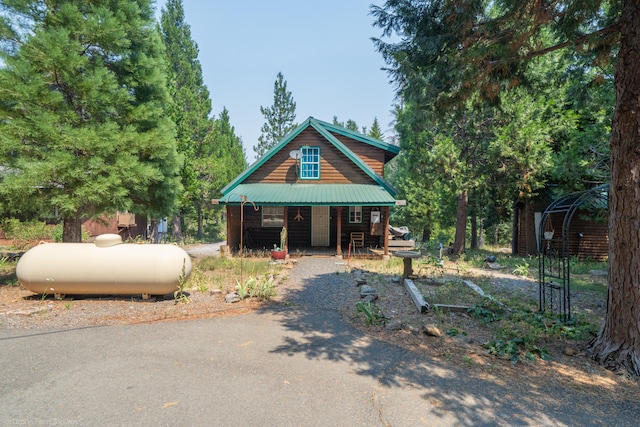 log-style house featuring a porch