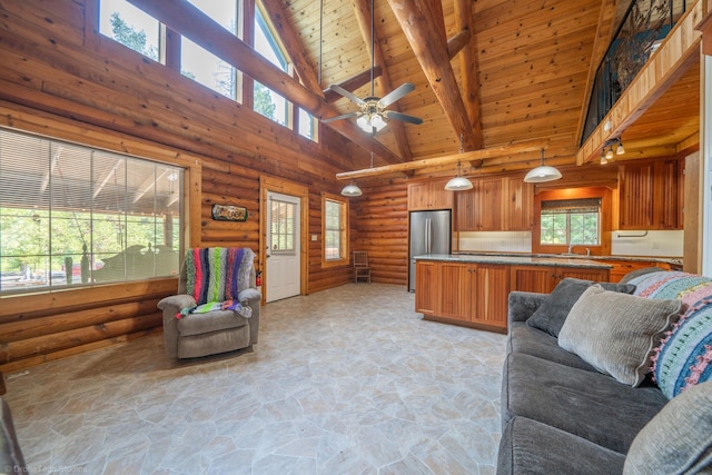 living area featuring high vaulted ceiling, wood ceiling, beamed ceiling, and stone flooring