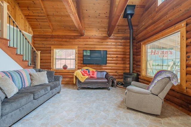 living room with wood ceiling, stairway, beamed ceiling, a wood stove, and log walls