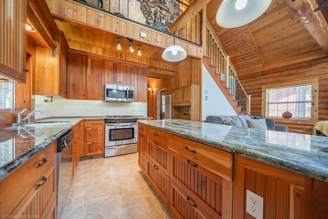 kitchen featuring dark stone countertops, appliances with stainless steel finishes, wooden ceiling, and decorative light fixtures