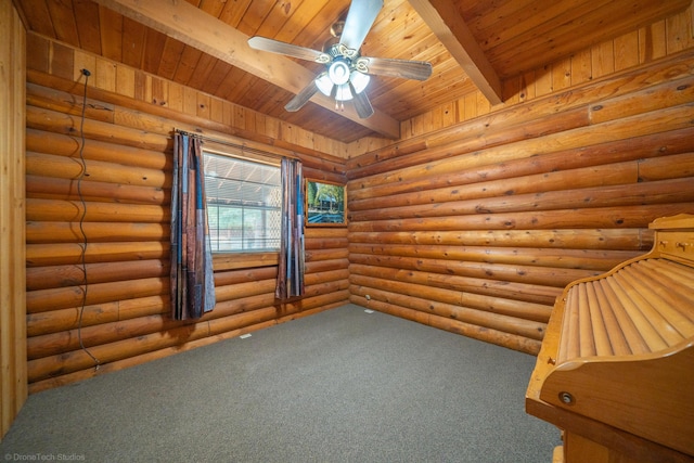 carpeted spare room with wood ceiling, a ceiling fan, and beamed ceiling