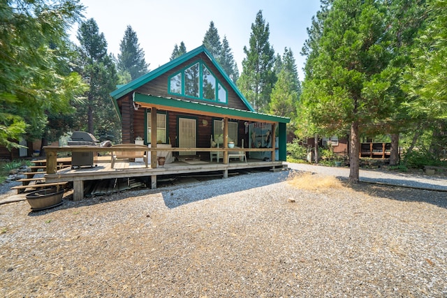 exterior space with metal roof and a porch