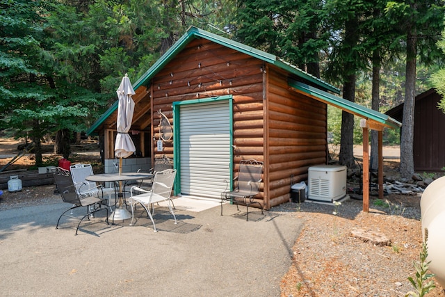 view of shed with outdoor dining space