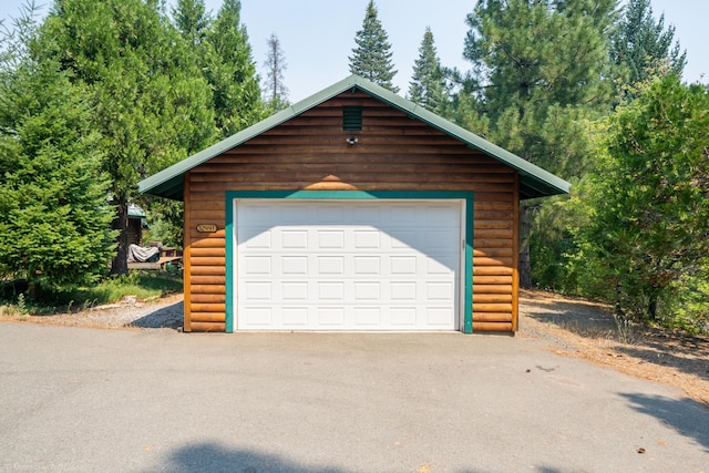 garage featuring aphalt driveway