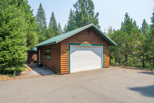 detached garage with aphalt driveway