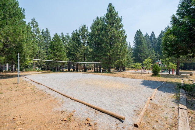 surrounding community with volleyball court and driveway