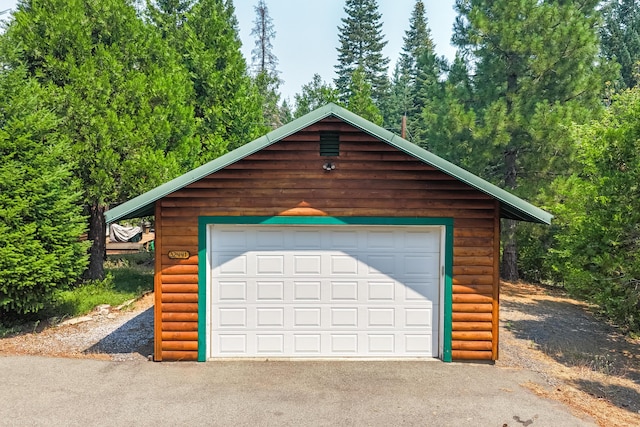 detached garage with aphalt driveway