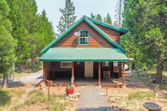 rustic home featuring metal roof