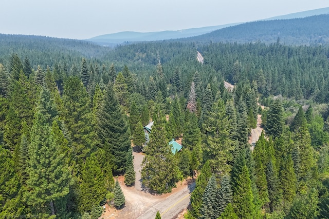 bird's eye view with a forest view and a mountain view