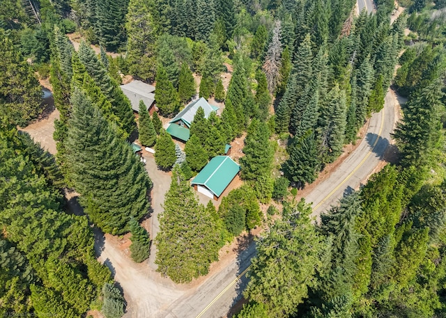 drone / aerial view with a wooded view