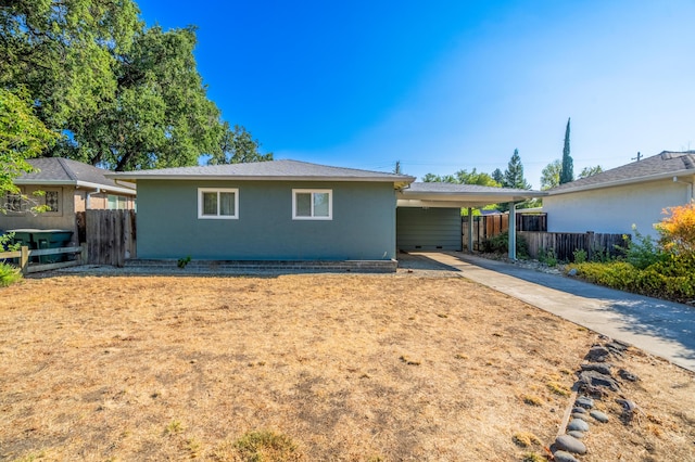 ranch-style house featuring a carport