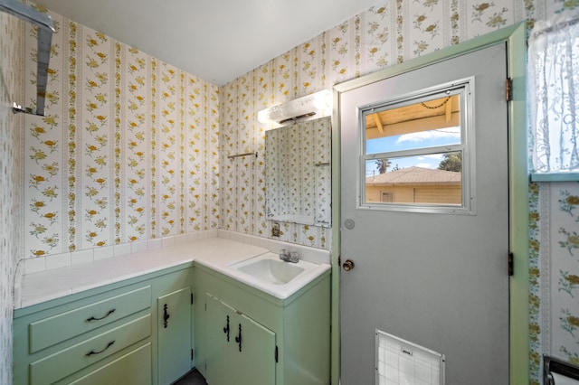 bathroom featuring a healthy amount of sunlight and vanity