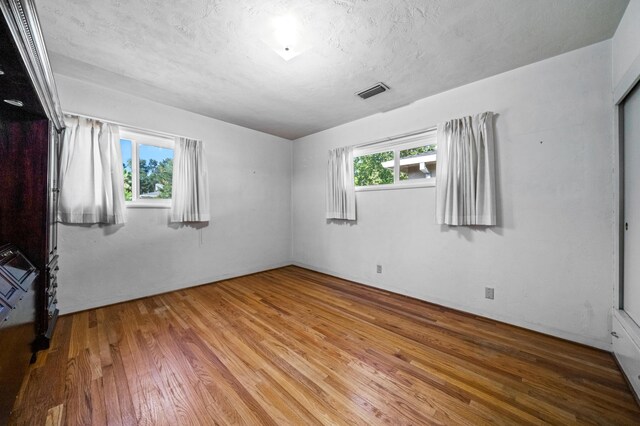 unfurnished room featuring light wood-type flooring