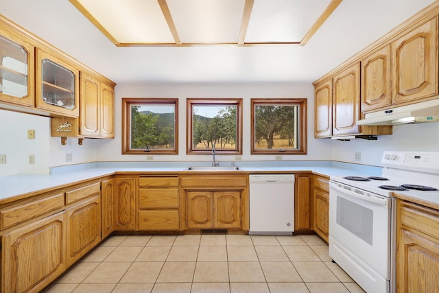 kitchen with sink, white appliances, and light tile patterned floors