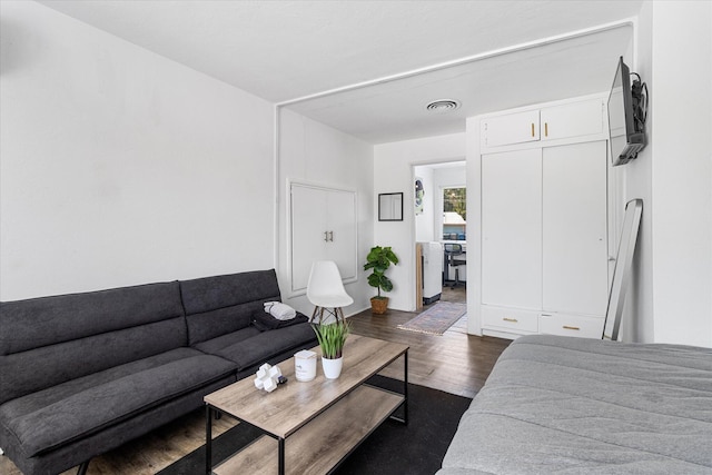 living room featuring dark hardwood / wood-style floors