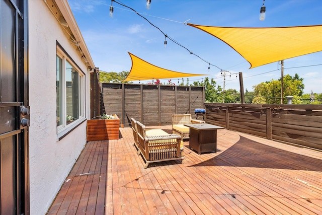 deck featuring a fire pit