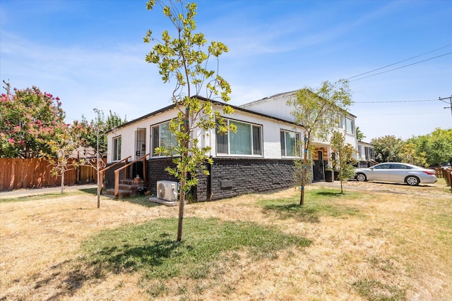 view of home's exterior with a yard