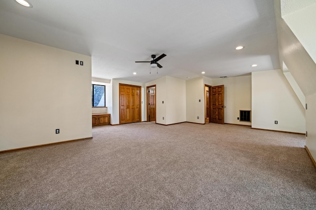 unfurnished living room with ceiling fan and light colored carpet