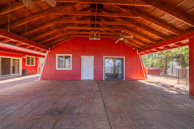 exterior space with a ceiling fan and fence