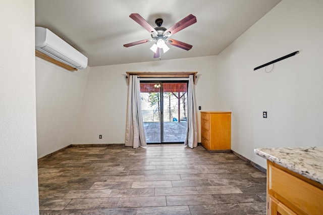 spare room with a wall mounted AC, lofted ceiling, and ceiling fan