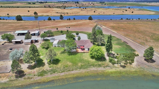 bird's eye view with a water view and a rural view