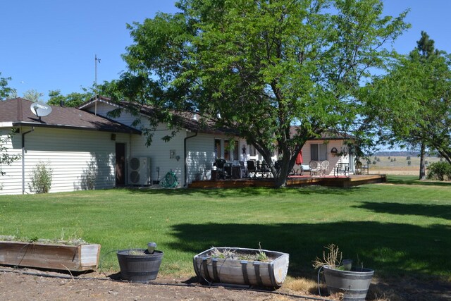 view of yard with a wooden deck