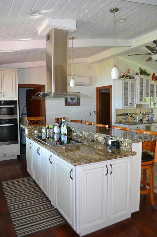 kitchen with white cabinets, wood ceiling, and island exhaust hood