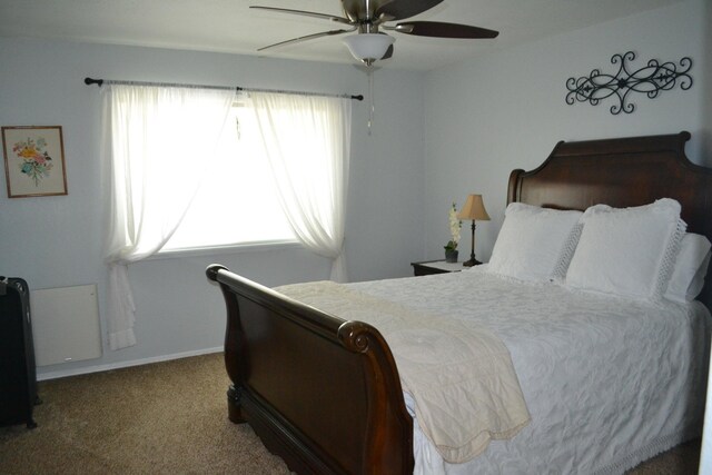 bedroom with ceiling fan and carpet floors