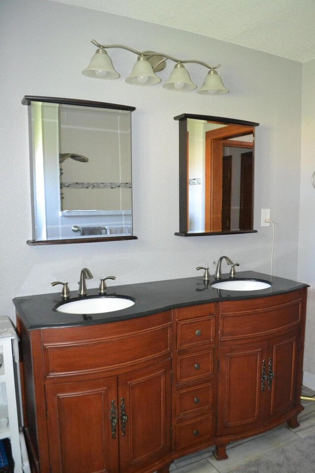 bathroom featuring double vanity