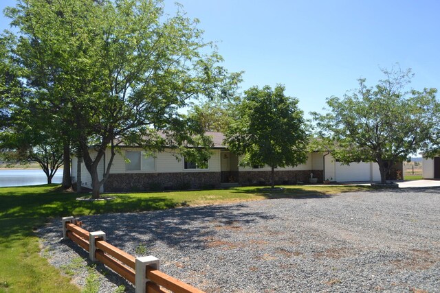 view of front facade with a front yard and a garage