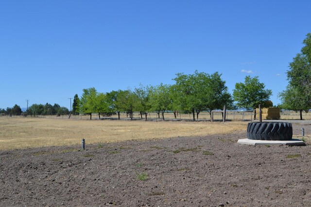 view of yard with a rural view