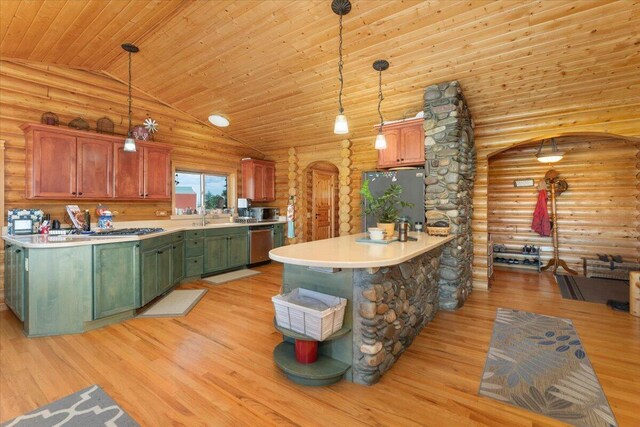 kitchen with log walls, pendant lighting, black fridge, and light hardwood / wood-style floors