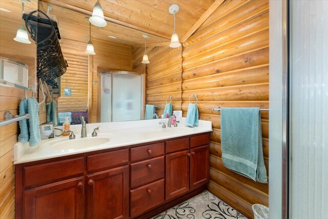 bathroom featuring dual vanity, log walls, and wooden ceiling