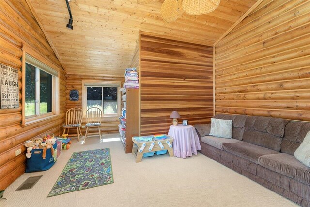 carpeted living room with log walls, vaulted ceiling, and wooden ceiling