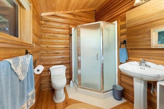 bathroom with rustic walls, wood-type flooring, a shower with door, and wood ceiling