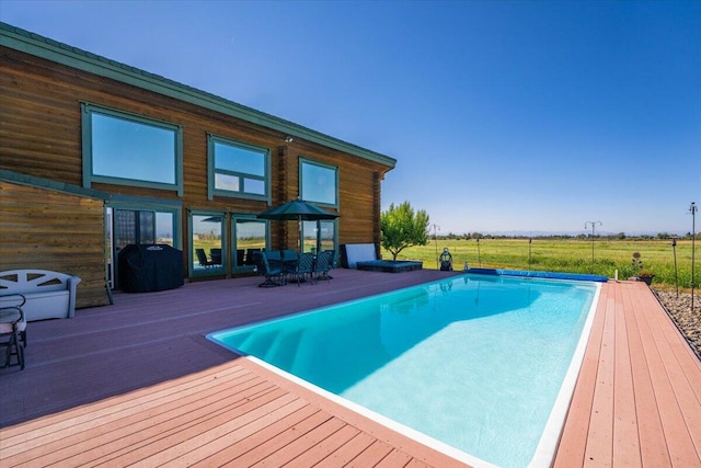 view of pool featuring a wooden deck